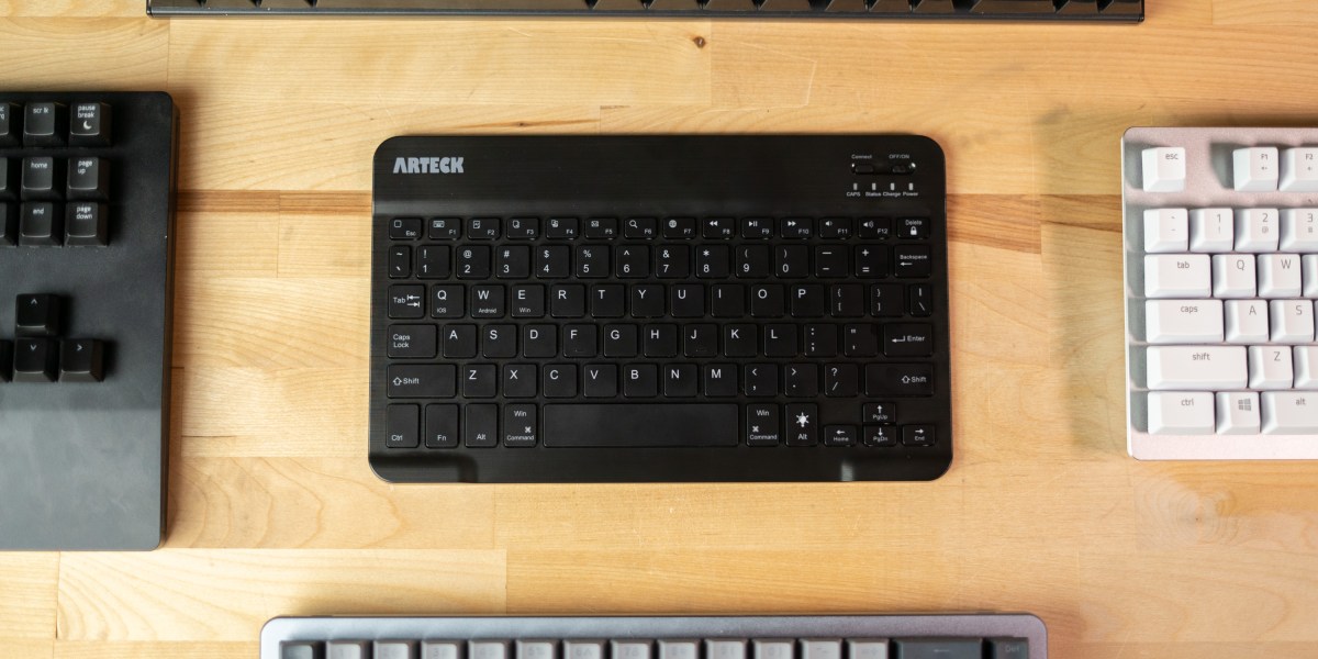 Arteck Bluetooth keyboard surrounded by other keyboards