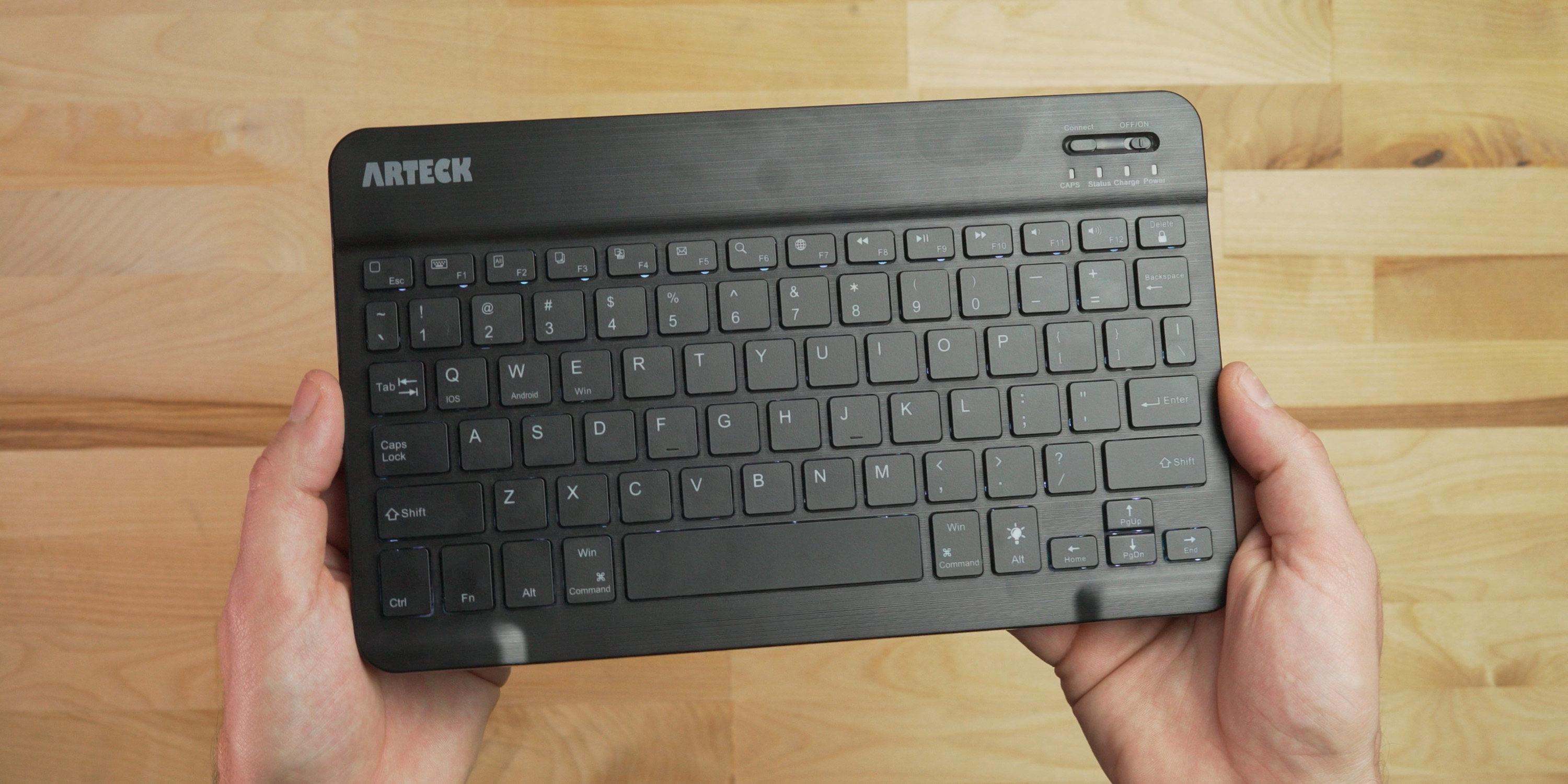 holding the Arteck Bluetooth Keyboard