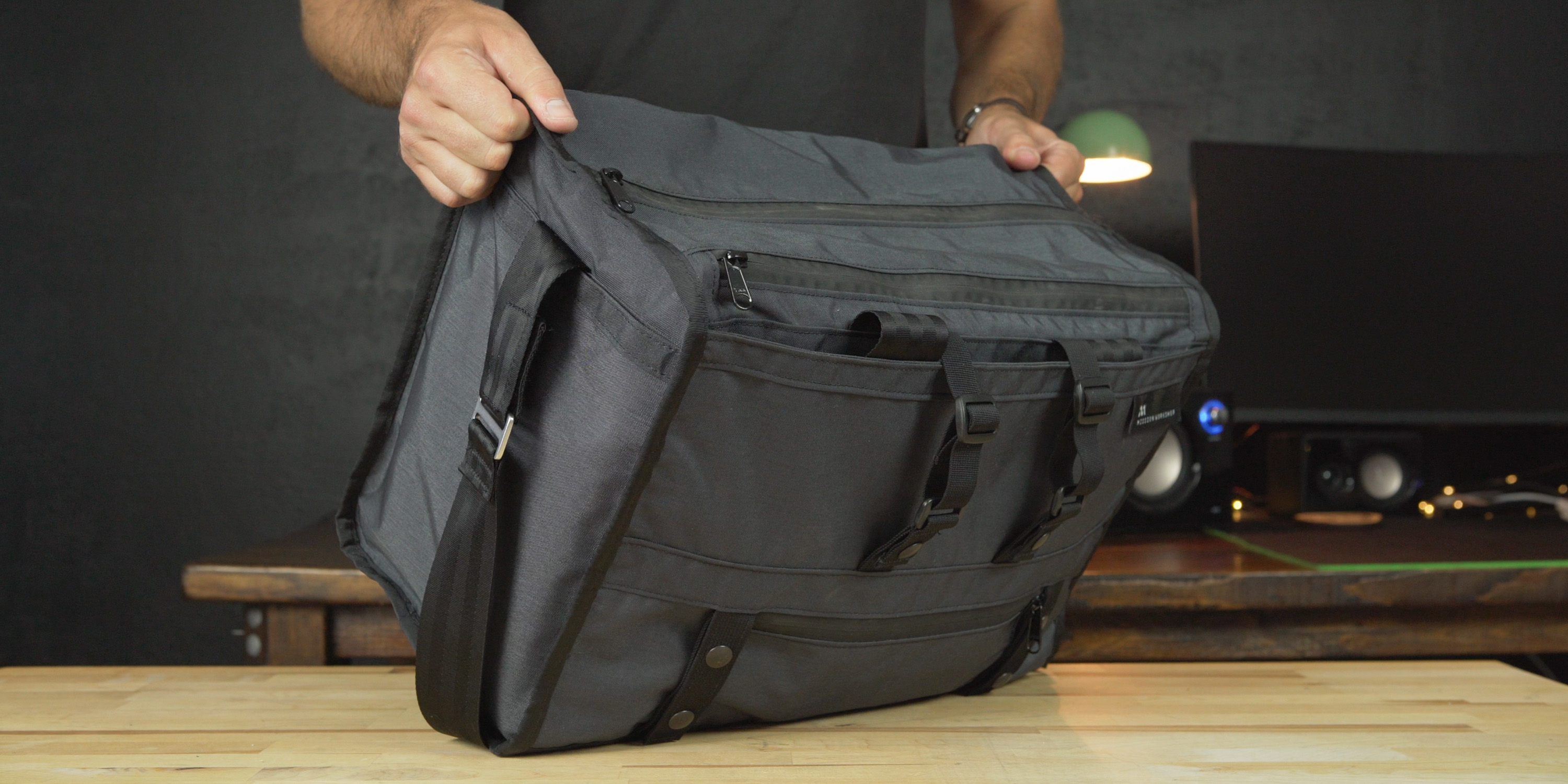 Transit Duffle with handles stored in side pockets