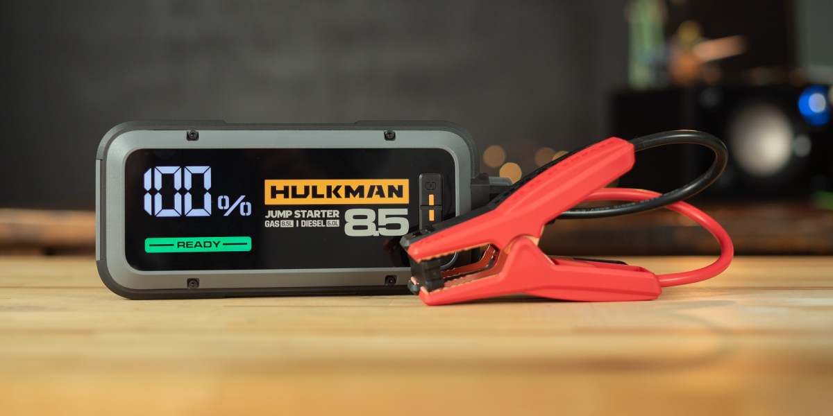 Hulkman Alpha 85S on desk with charging cables