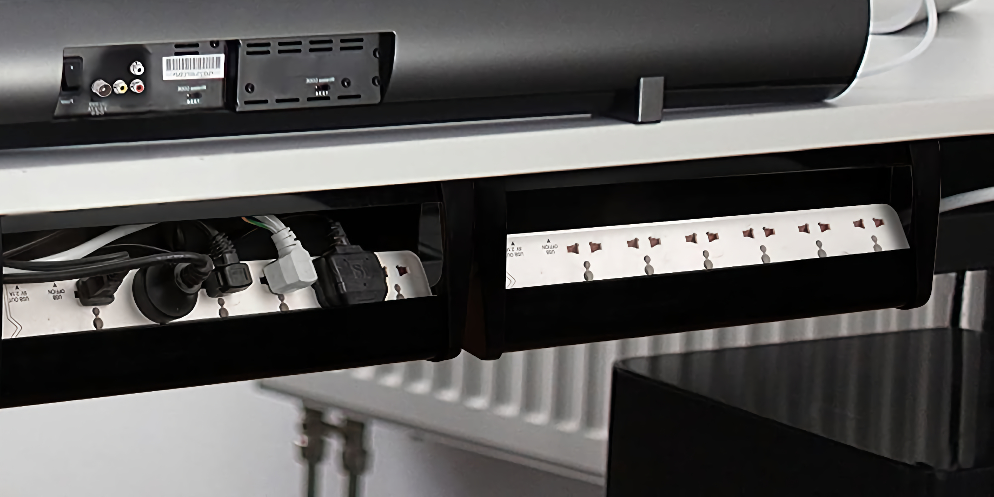 Tidy up power strips, cords, and more with this under-desk cable