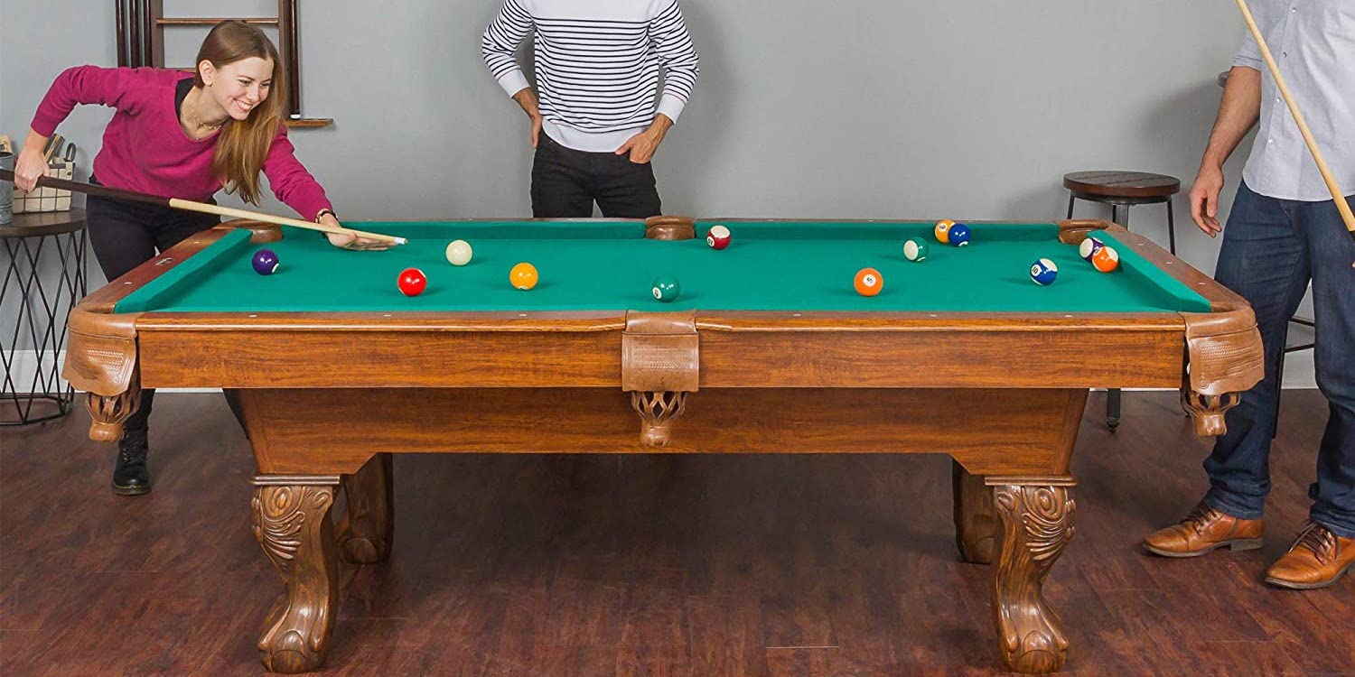 Put EastPoint's wood Masterton Pool Table bundle in the man cave for