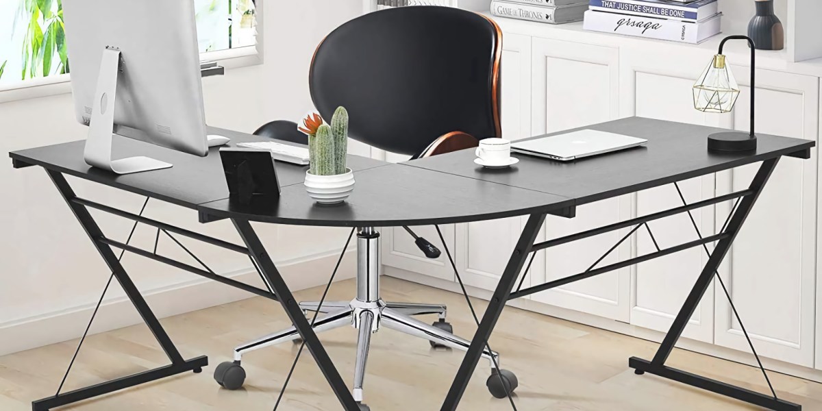 This black glass Lshaped desk ships to your door for under 81 (Reg. 100)