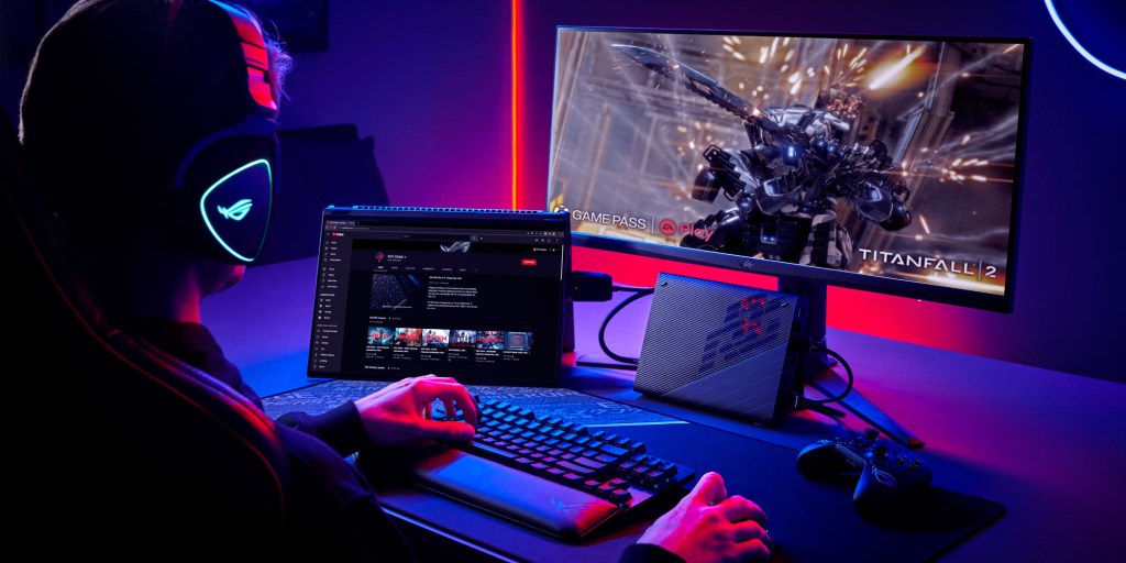 asus rog swift x16 miniled gaming laptop at a desk being used to game like a desktop