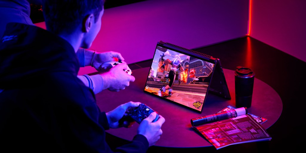 asus rog swift x16 miniled gaming laptop on a table in tent mode