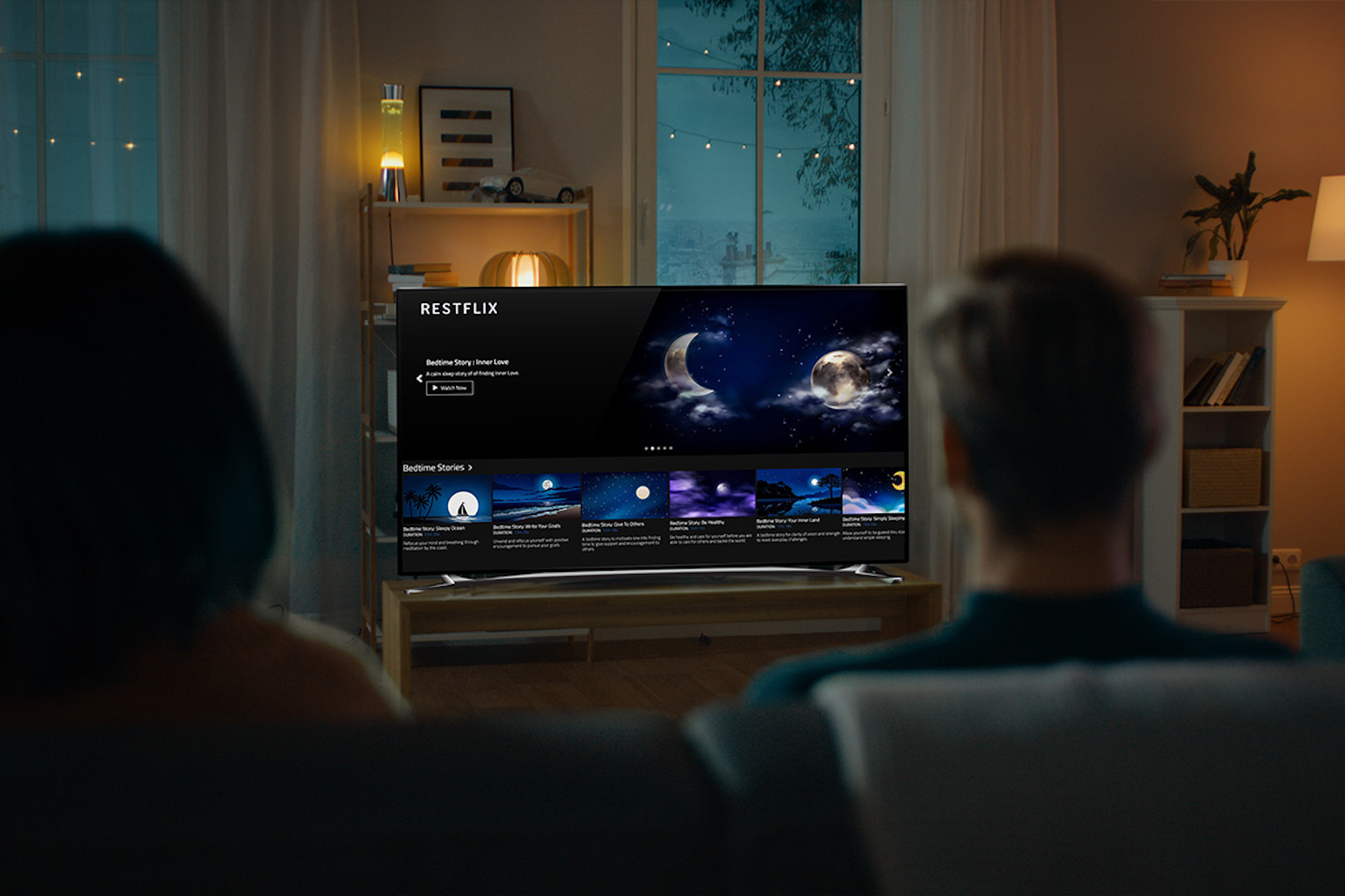 a person standing in front of a television