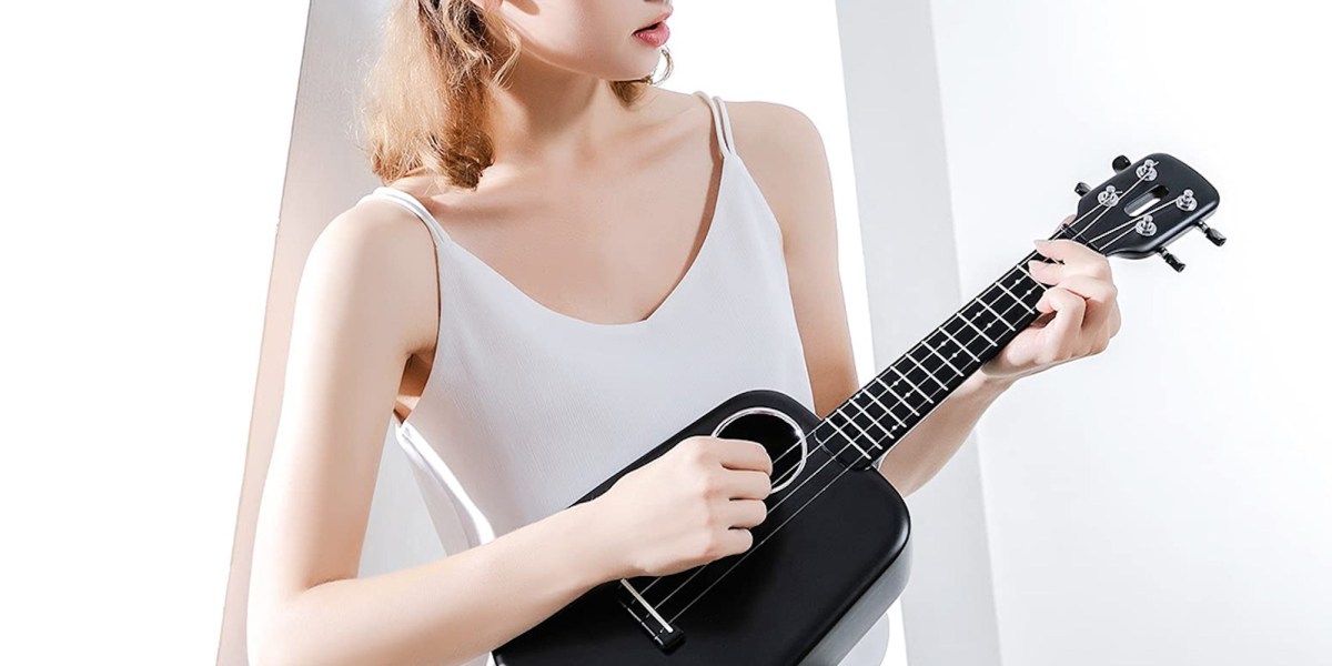 a woman holding a guitar