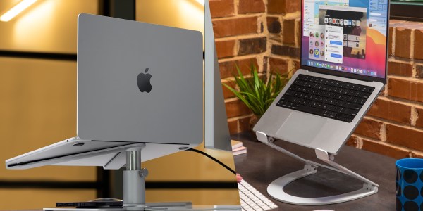 a desk with a laptop computer sitting on top of a table