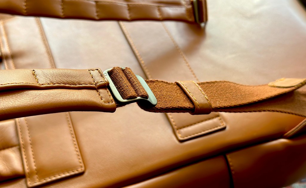 a close up of a brown leather bag