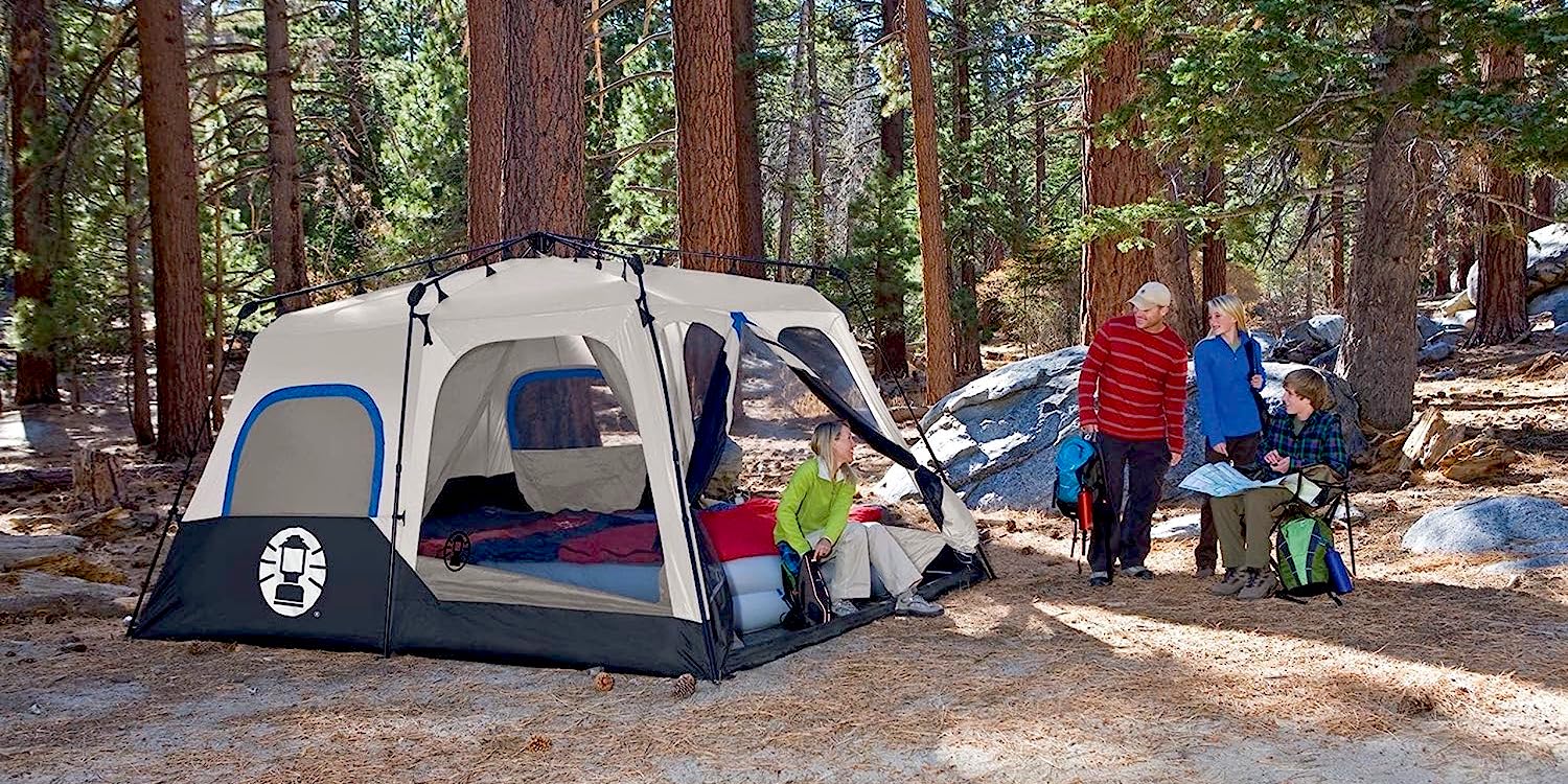 a group of people sitting in a tent