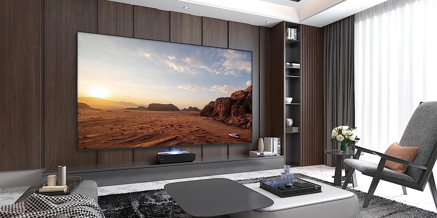 a living room filled with furniture and a large window