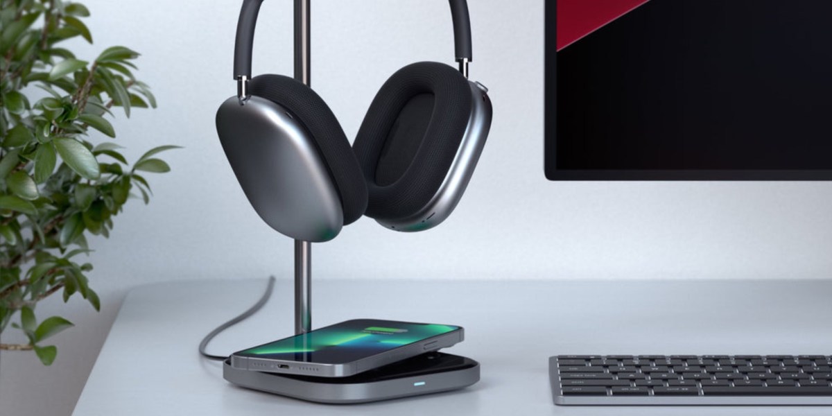 a desk with a monitor keyboard and mouse on a table