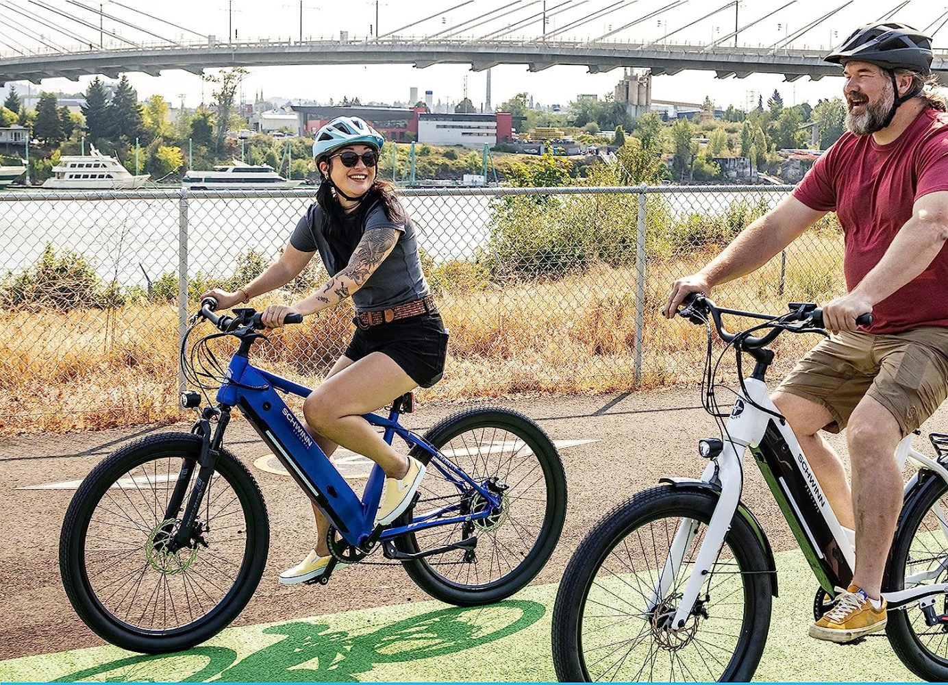 a man riding a bike down a dirt road