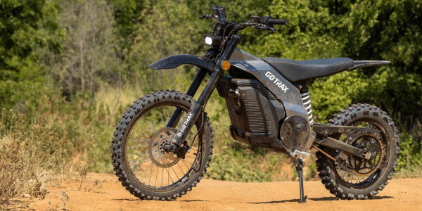 a motorcycle parked on a dirt road