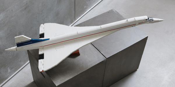 a small plane sitting on top of a ramp