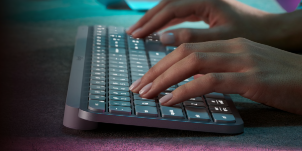 a person using a mouse and keyboard