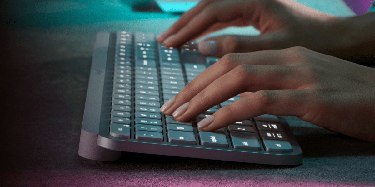 a person using a mouse and keyboard