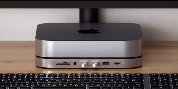 a laptop computer sitting on top of a keyboard