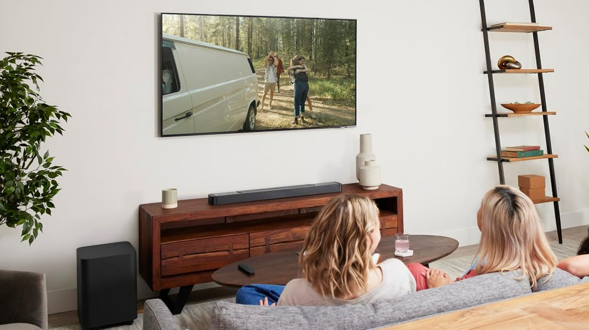 a group of people sitting around a living room