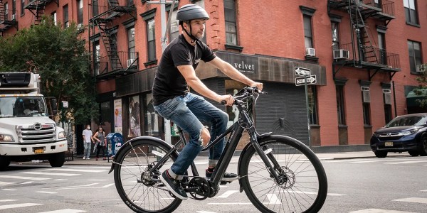 a person riding a bicycle on a city street
