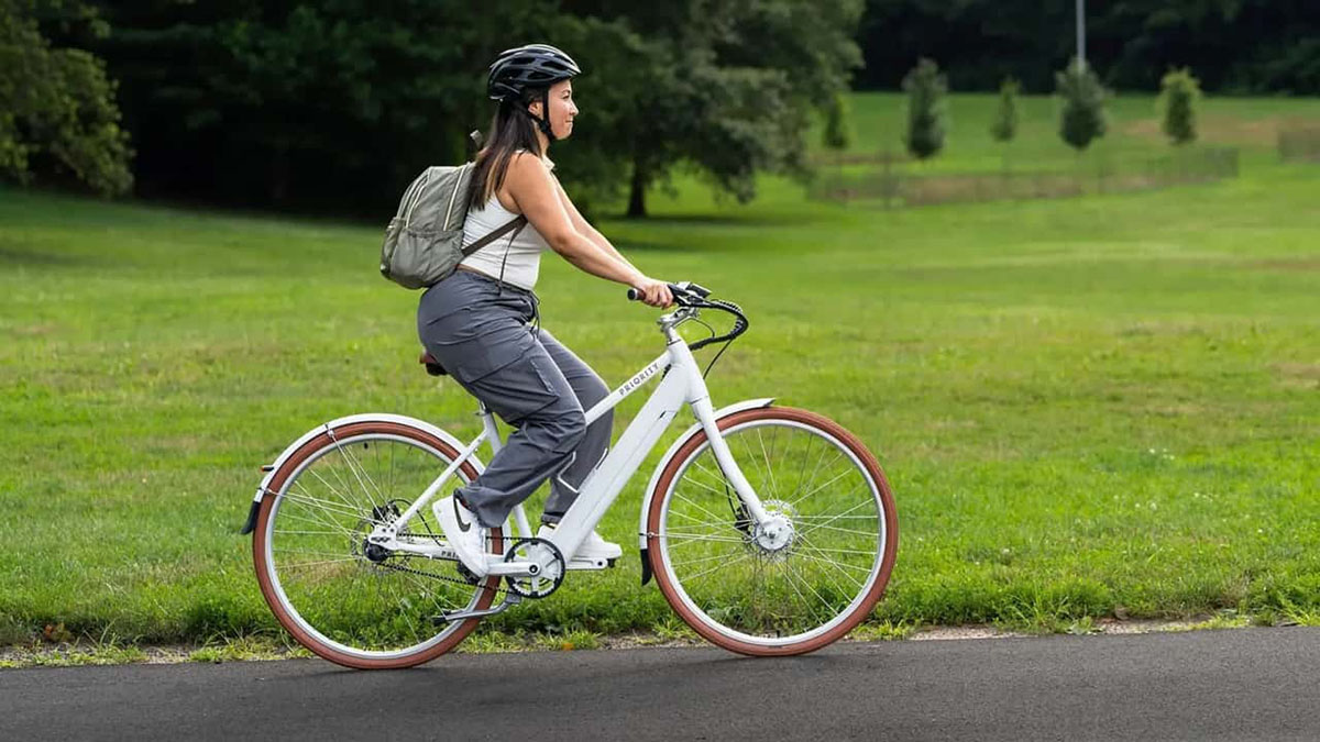 a man riding on the back of a bicycle