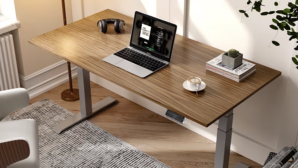 a laptop computer sitting on top of a wooden table