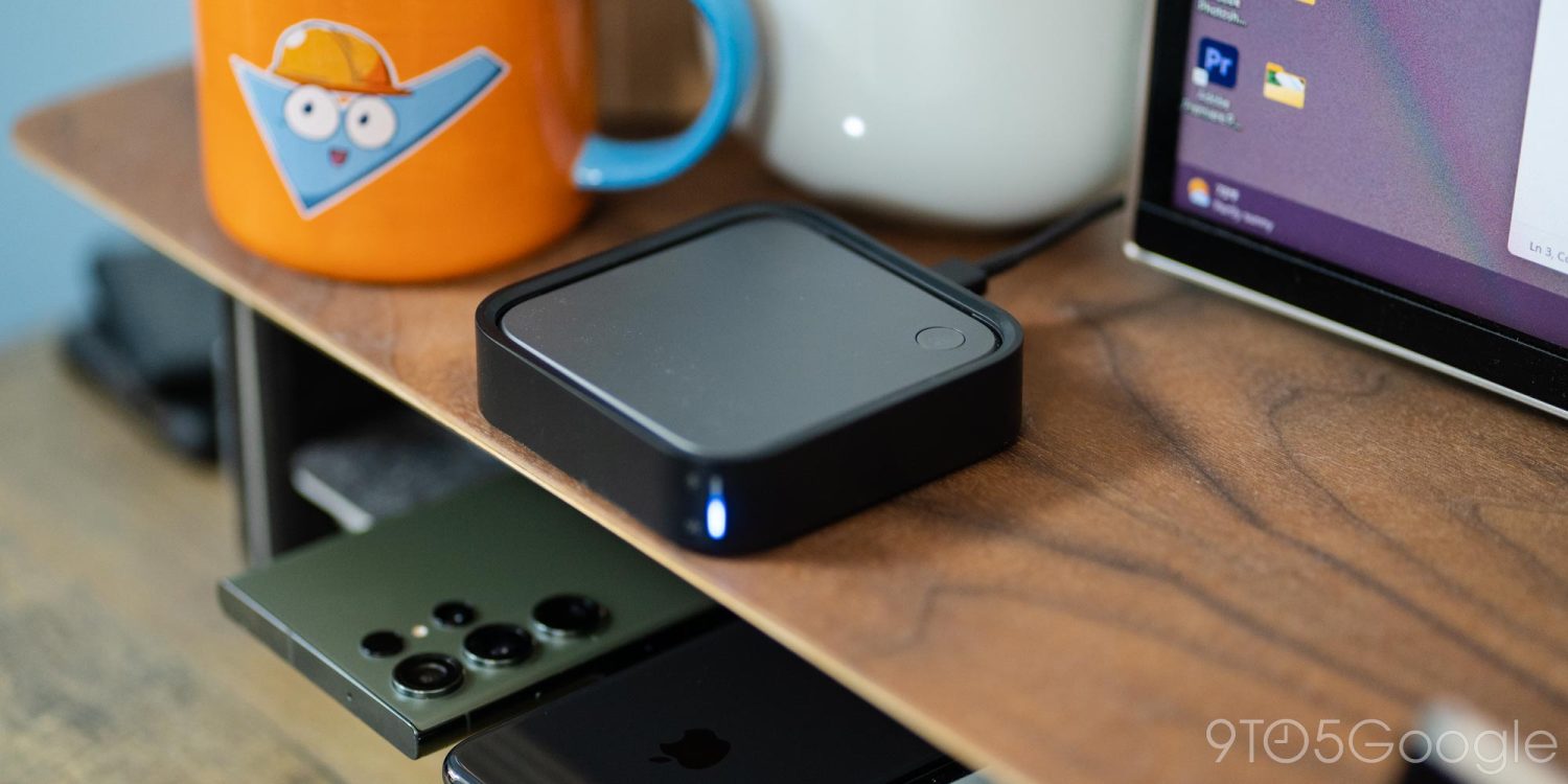 a laptop computer sitting on top of a wooden table