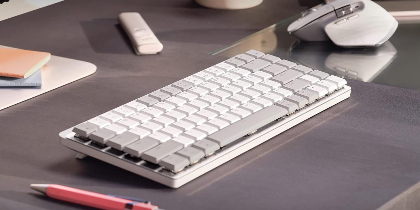 a desk with a computer mouse and keyboard