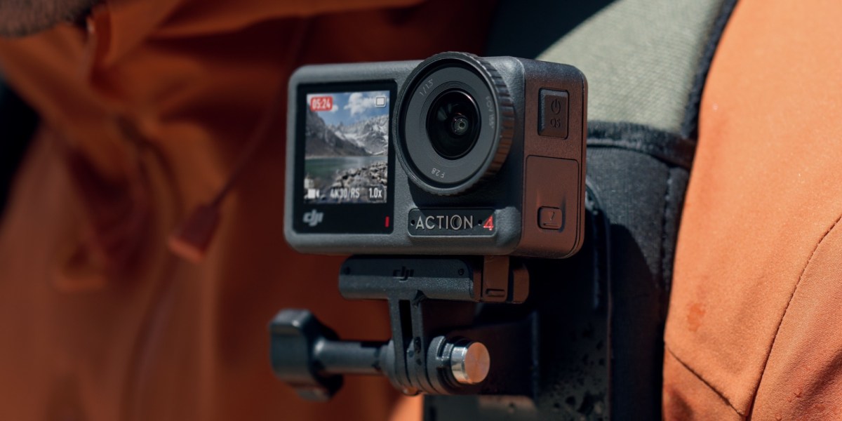 a close up of a person holding a camera