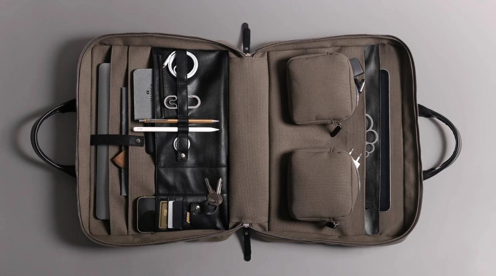 a piece of luggage sitting on top of a suitcase