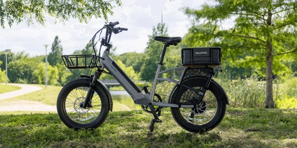 a motorcycle parked on top of a lush green field