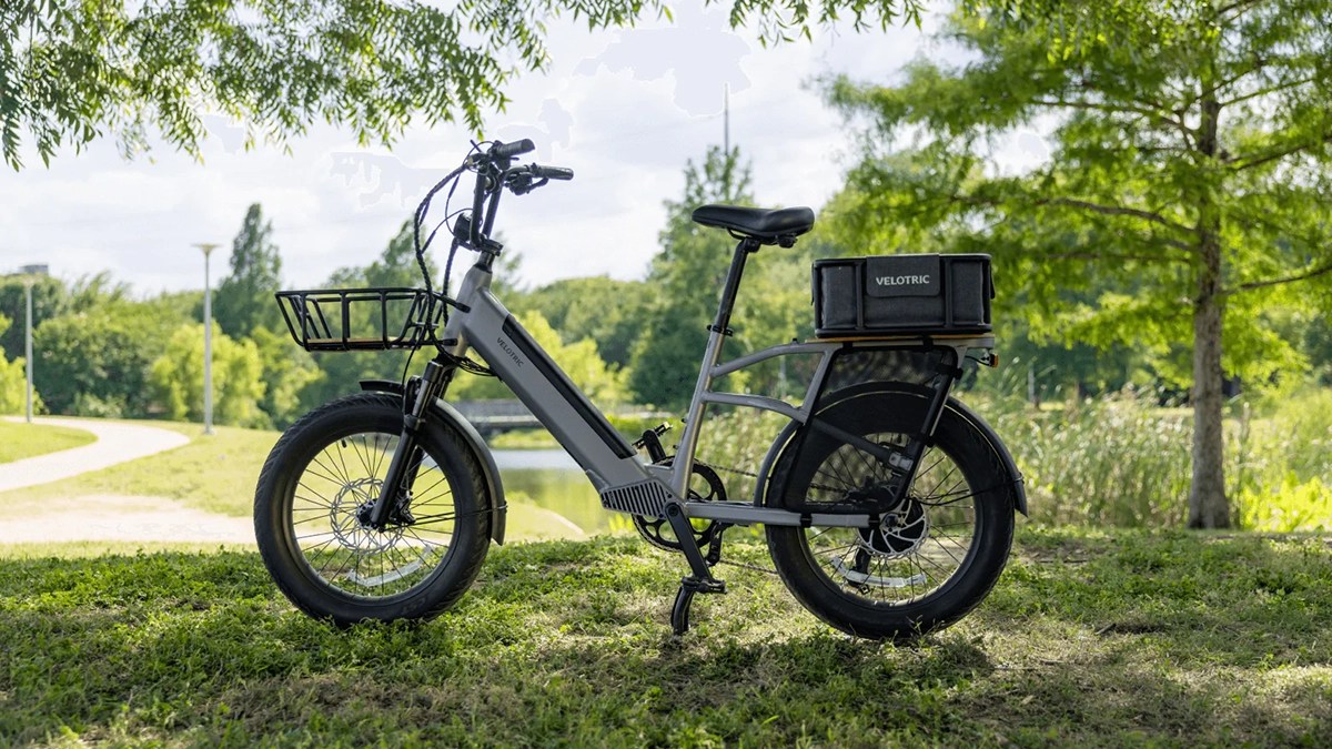 a motorcycle parked on top of a lush green field