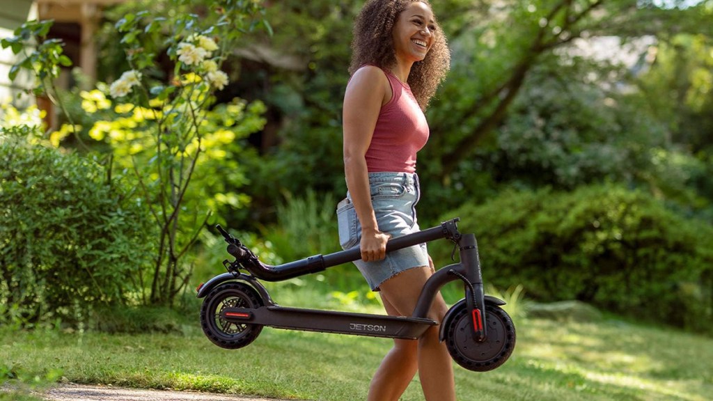 a person riding a bike down a dirt road