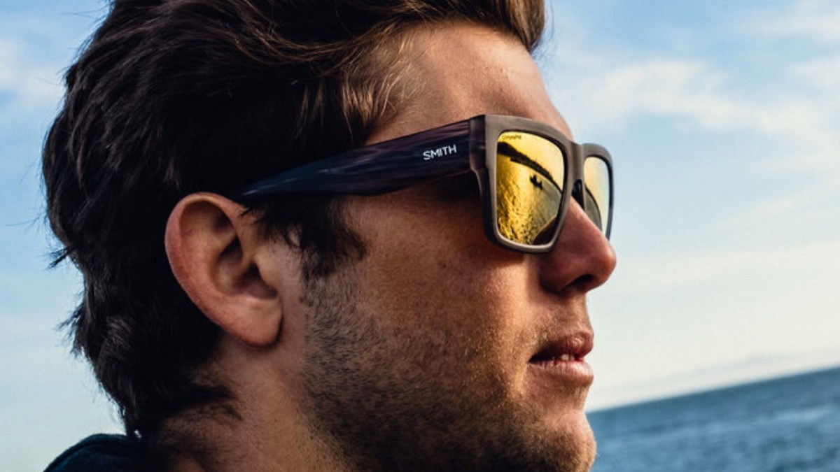 a close up of a man wearing sunglasses