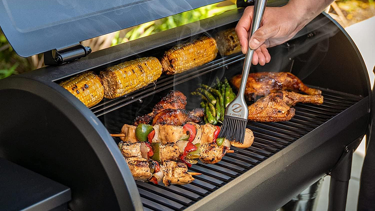 a person cooking food on a grill