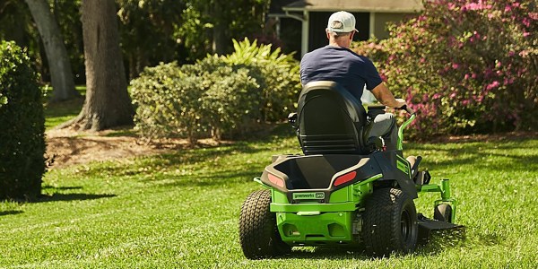 a man driving a lawn mower