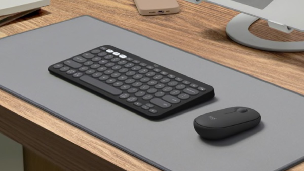 a keyboard and mouse on a desk