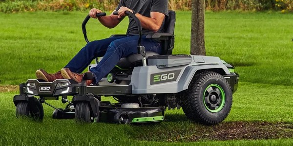 a man riding a lawn mower