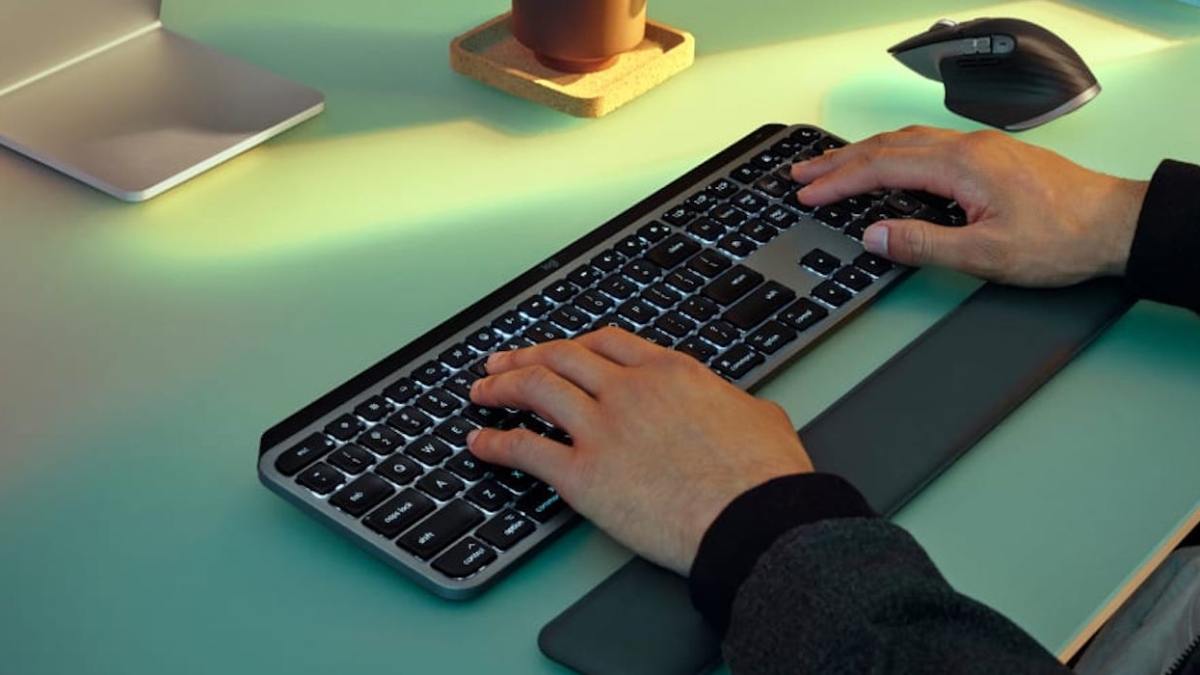 hands typing on a keyboard