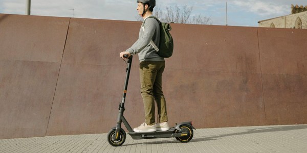 a man riding a scooter