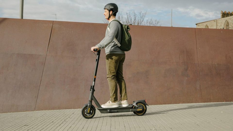 a man riding a scooter