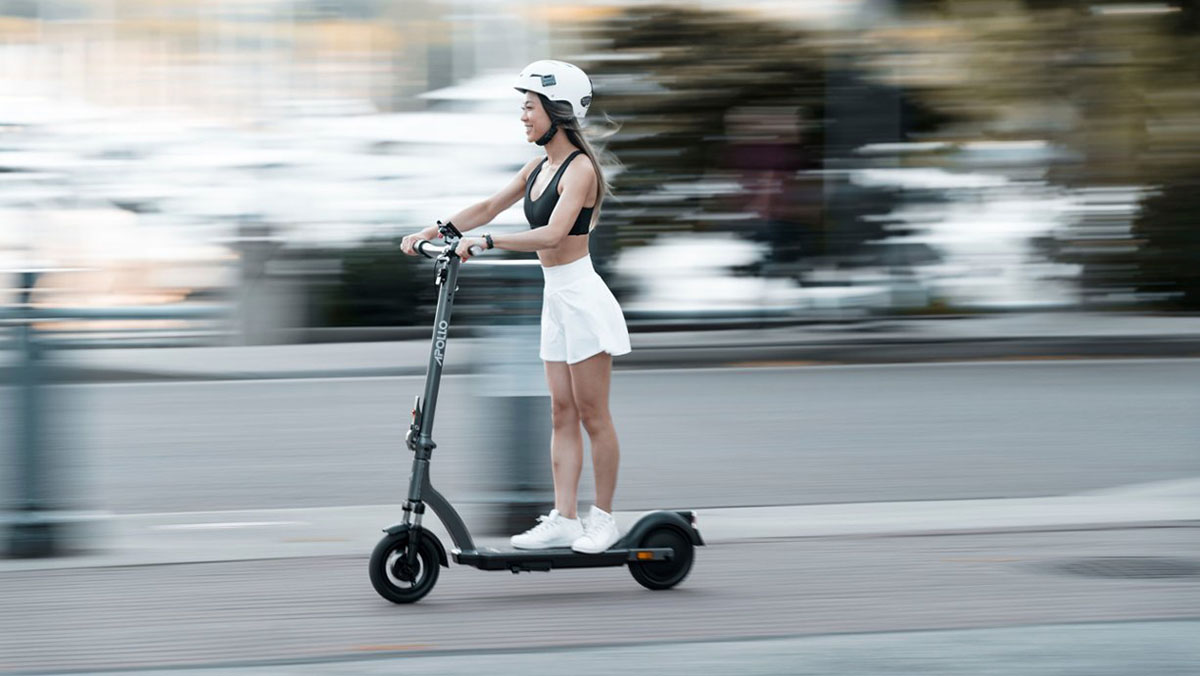 a woman on a scooter