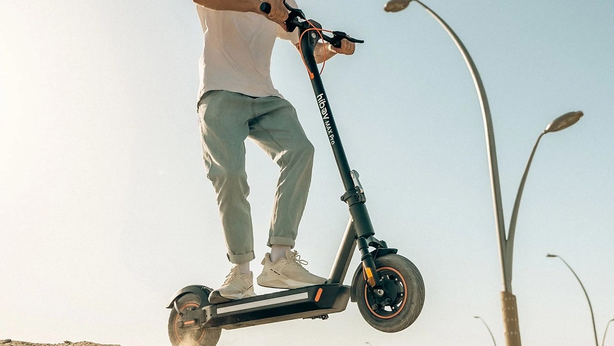 a man riding a scooter