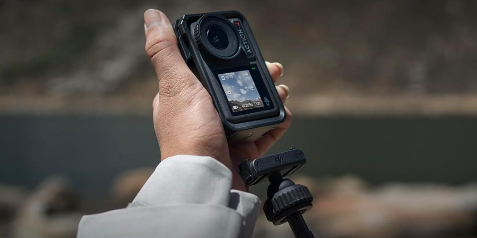 Image showing a person using DJI Osmo Action 4 camera.