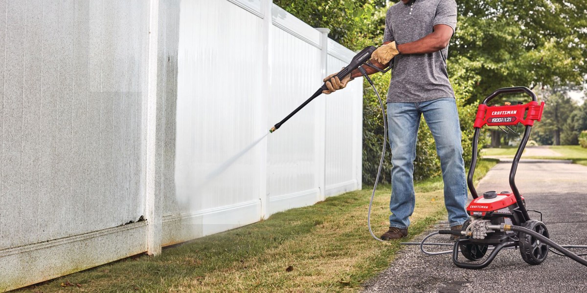 a person pushing a lawn mower