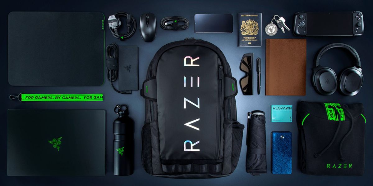 An image showing Razer's Rogue V3 backpack next to a bunch of gear.