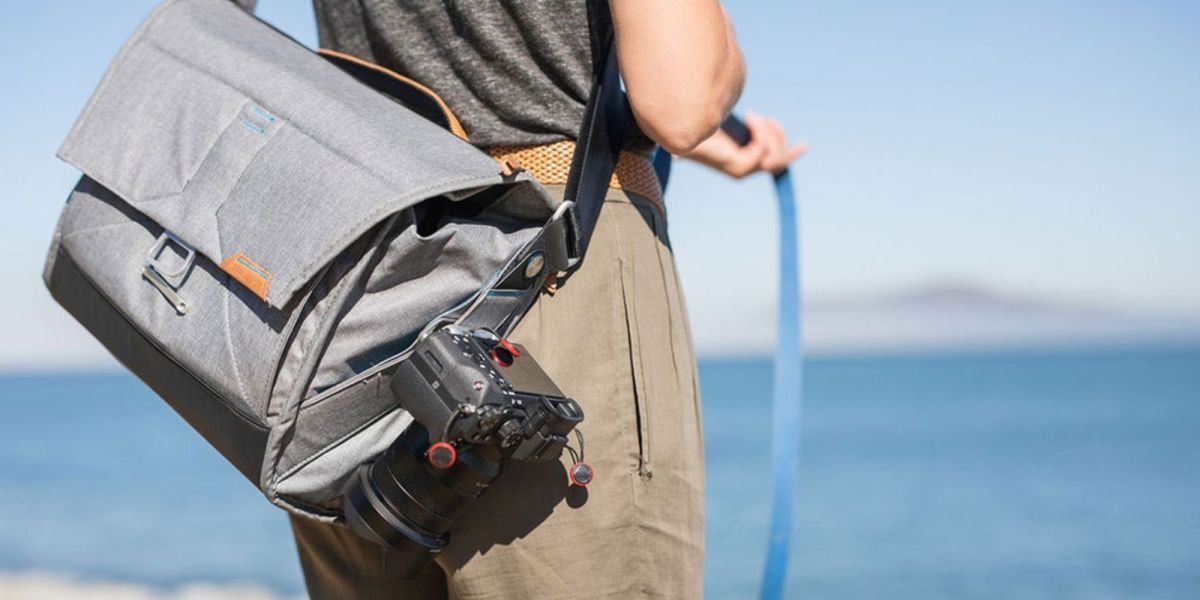 Image showing a person wearing Peak Desgin's Everyday Messenger bag in Ash colorway.