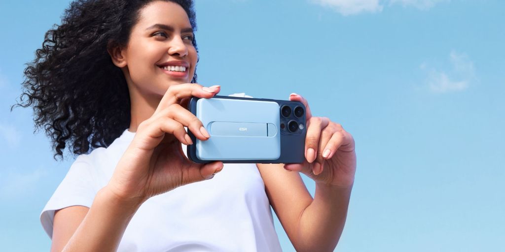 An image showing a person using an iPhone with ESR MagSafe power bank.