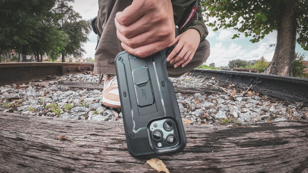 Image showing a person holding an iPhone with SUPCASE UB Pro case.