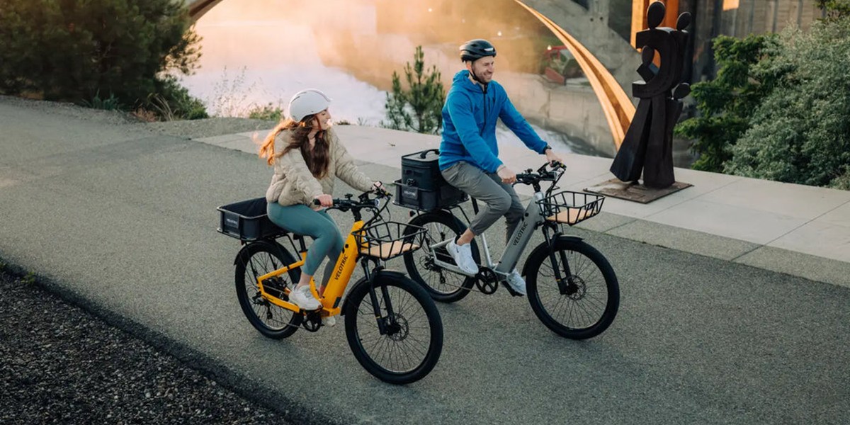 a man and a woman riding bikes